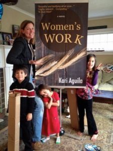 The day the banner for Women's Work arrived! Our kids approve!